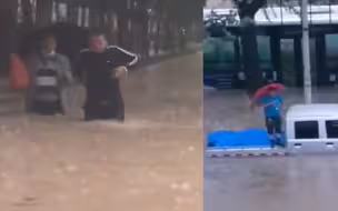 暴雨致西宁内涝严重 街上积水齐腰深 货车司机站车斗上等待救援