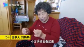 大连一居民楼楼梯扶手“穿毛衣” 网友：这邻居有心了！