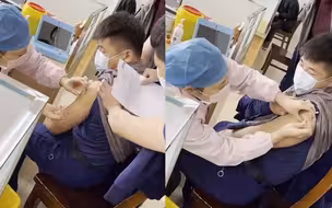 消防员去打针 嘴上说不怕身体很诚实 不自觉往后躲被队友一把按住