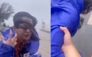台风“暹芭”登陆 记者现场凌乱播报 摄像大哥担心被吹跑一把拉住