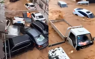 河南焦作洪水袭村 道路成河车辆成船顺流而下