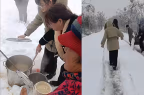 返乡人被雨雪困在高速 周边老百姓拖家带口推车送热水吃食